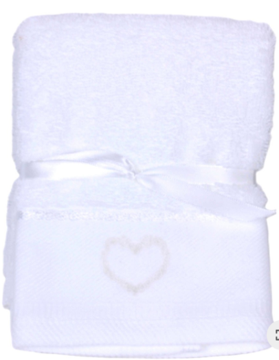 A folded white cotton towel with a satin ribbon tied around the middle and a small embroidered heart on the front, shown on a plain white background.